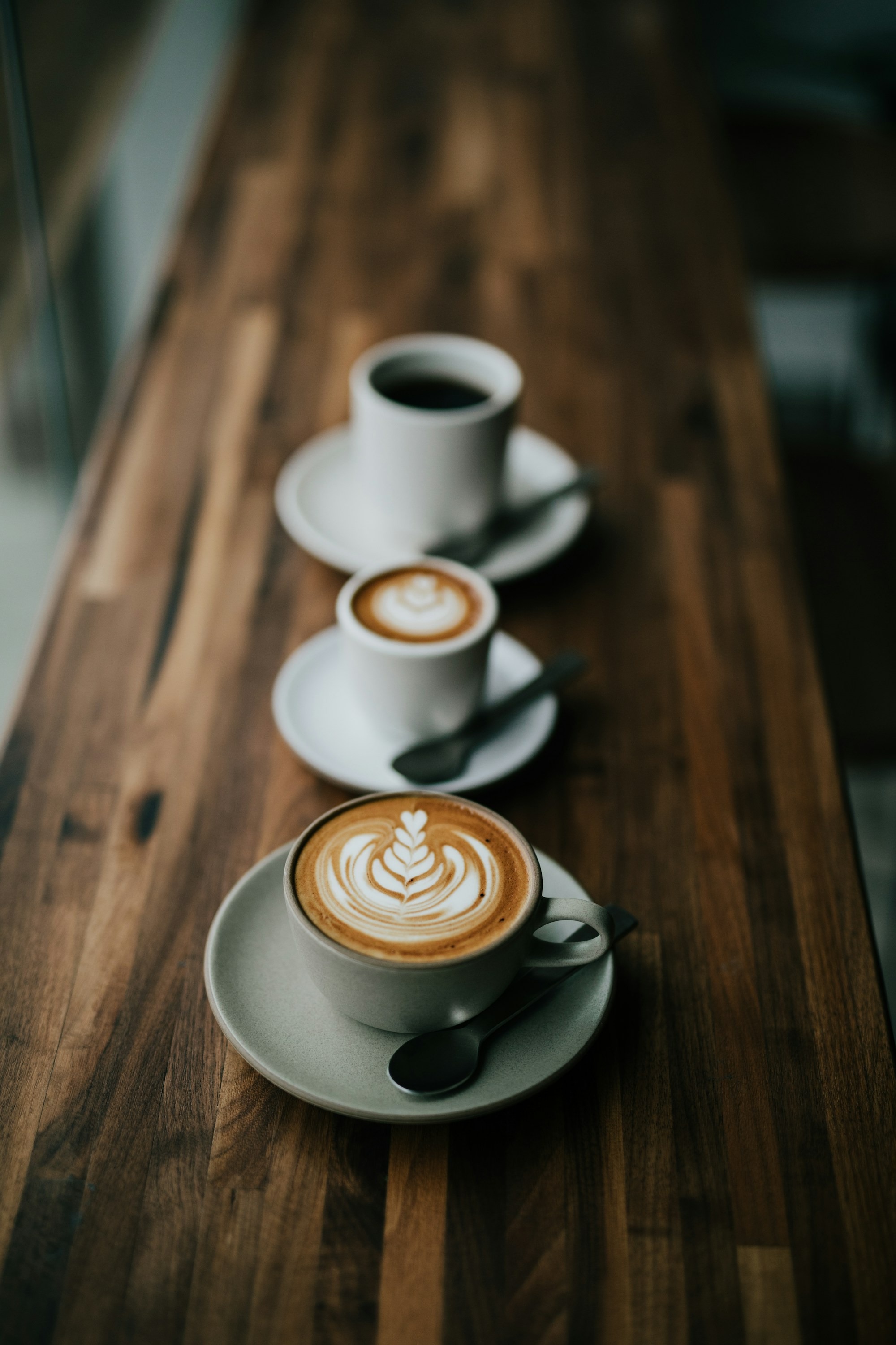 Cup of latte on table